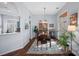 Charming dining room with hardwood floors, a vintage hutch, and a beautiful rug, creating a warm and inviting atmosphere at 11414 Coreopsis Rd, Charlotte, NC 28213