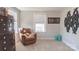 A cozy bedroom nook includes a brown recliner, dresser, and window for natural light at 117 Tomahawk Dr, Mooresville, NC 28117