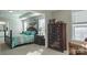 A Primary bedroom suite has a four-poster bed, dresser, and sunny sitting area at 117 Tomahawk Dr, Mooresville, NC 28117