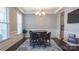 Elegant dining room with wainscoting and a modern chandelier at 117 Tomahawk Dr, Mooresville, NC 28117