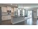 Well-lit kitchen with stainless steel appliances, subway tile backsplash, and hardwood floors at 117 Tomahawk Dr, Mooresville, NC 28117