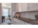 Close-up view of kitchen featuring stylish countertops and elegant white cabinets at 117 Tomahawk Dr, Mooresville, NC 28117