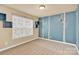 Bedroom with blue accent wall and built-in shelves at 1227 Mountain Laurel Ct, Matthews, NC 28104