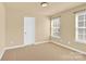 Bright bedroom with neutral walls and carpet at 1227 Mountain Laurel Ct, Matthews, NC 28104