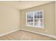 Bedroom with large window and neutral decor at 1227 Mountain Laurel Ct, Matthews, NC 28104