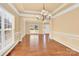 Bright dining room with hardwood floors and a chandelier at 1227 Mountain Laurel Ct, Matthews, NC 28104