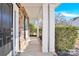 Inviting front porch with brick and white columns at 1227 Mountain Laurel Ct, Matthews, NC 28104