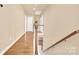 Upstairs hallway with hardwood floors and access to bedrooms at 1227 Mountain Laurel Ct, Matthews, NC 28104