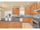 Kitchen with light wood cabinets, granite countertops, and island at 1227 Mountain Laurel Ct, Matthews, NC 28104