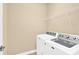 Laundry room with washer, dryer, and overhead shelving at 1227 Mountain Laurel Ct, Matthews, NC 28104