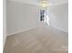 Carpeted bedroom with ceiling fan and window at 133 Jacobs Woods Cir, Troutman, NC 28166