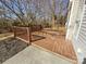 Back deck with wooden railings, overlooking a wooded area at 133 Jacobs Woods Cir, Troutman, NC 28166