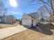 Two-story house with attached garage and driveway, in a residential neighborhood at 133 Jacobs Woods Cir, Troutman, NC 28166