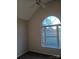 Bright bedroom featuring a large arched window and ceiling fan at 1331 Copper Creek Ln, Fort Mill, SC 29715