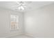 Simple bedroom with window and ceiling fan at 13443 Norseman Ln, Huntersville, NC 28078