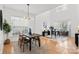 Open concept dining area with hardwood floors and modern lighting at 13443 Norseman Ln, Huntersville, NC 28078