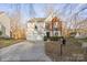 Two-story house with a white and brick exterior, attached garage, and landscaping at 13443 Norseman Ln, Huntersville, NC 28078