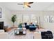 Living room with fireplace, hardwood floors, and large windows at 13443 Norseman Ln, Huntersville, NC 28078