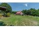 Red metal roof barn with fenced yard at 1519 Triplett Rd, Cleveland, NC 27013