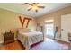 Bright bedroom with wood floors, ceiling fan, and large window at 1519 Triplett Rd, Cleveland, NC 27013