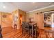 Dining area with wood walls and barn door at 1519 Triplett Rd, Cleveland, NC 27013