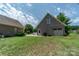 Detached brick garage with a large door and ample space at 1519 Triplett Rd, Cleveland, NC 27013