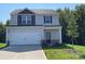 Two-story house with gray siding, a two-car garage, and a landscaped lawn at 1524 Doran Ter, Richburg, SC 29729