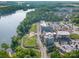 Aerial view of a community near a river with shops and parking at 1575 Riverwalk Pkwy, Rock Hill, SC 29730