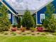 Landscaped backyard with lush greenery and colorful flowers at 1575 Riverwalk Pkwy, Rock Hill, SC 29730