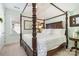 Charming bedroom with a four-poster bed and soothing pastel walls at 1575 Riverwalk Pkwy, Rock Hill, SC 29730