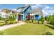 Charming blue home with a well-manicured lawn and a vibrant pink front door at 1575 Riverwalk Pkwy, Rock Hill, SC 29730