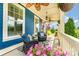 Inviting front porch featuring comfortable wicker seating, ceiling fans, and beautiful landscaping at 1575 Riverwalk Pkwy, Rock Hill, SC 29730