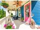 Charming front porch with comfortable seating, decorative accents, and a cheerful pink door at 1575 Riverwalk Pkwy, Rock Hill, SC 29730