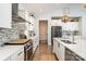 Modern white kitchen with stainless steel appliances and light wood floors at 1575 Riverwalk Pkwy, Rock Hill, SC 29730