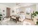 Bright main bedroom with large windows, decorative rug, and sitting area at 1575 Riverwalk Pkwy, Rock Hill, SC 29730