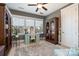 Well-lit home office with a large desk, bookcase, and neutral decor at 1575 Riverwalk Pkwy, Rock Hill, SC 29730