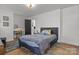 Bedroom with a gray accent wall, a bed, and a desk at 19705 S Ferry St, Cornelius, NC 28031