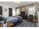 Bedroom featuring neutral colors, geometric wallpaper, and two large windows at 19705 S Ferry St, Cornelius, NC 28031