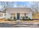 Charming single-story home featuring a covered front porch with seating and a well-maintained front yard at 19705 S Ferry St, Cornelius, NC 28031