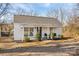 Charming single-story home featuring a covered front porch with seating and a well-maintained front yard at 19705 S Ferry St, Cornelius, NC 28031