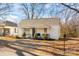 Charming single-story home featuring a covered front porch with seating and a well-maintained front yard at 19705 S Ferry St, Cornelius, NC 28031