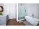 Modern bathroom with a large walk-in shower and freestanding tub at 2002 Summey Ave # 3, Charlotte, NC 28205