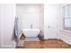 Elegant bathroom with soaking tub, walk-in shower, and hardwood floors at 2002 Summey Ave # 3, Charlotte, NC 28205