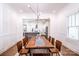 Dining room with a long wooden table and modern light fixture at 2002 Summey Ave # 3, Charlotte, NC 28205