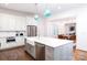 Open concept kitchen with island, stainless steel appliances, and blue lighting at 2002 Summey Ave # 3, Charlotte, NC 28205