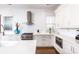 Modern white kitchen with stainless steel appliances and marble countertops at 2002 Summey Ave # 3, Charlotte, NC 28205