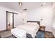 Spacious bedroom with a large bed and barn door to the bathroom at 2002 Summey Ave # 3, Charlotte, NC 28205