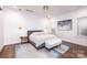 Main bedroom with a king-size bed and modern decor at 2002 Summey Ave # 3, Charlotte, NC 28205