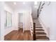 Bright entryway with hardwood floors, a staircase, and a half-bathroom at 2002 Summey Ave # 3, Charlotte, NC 28205