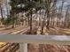 View of the backyard through the screened porch at 203 Shane Dr, Mount Holly, NC 28120